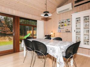 a dining room with a table and chairs at 6 person holiday home in Læsø-By Traum in Læsø
