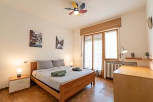 a bedroom with a bed with a stuffed animal on it at Parcheggio Privato - 5 minuti dal Lago di Varese in Varese