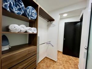 a closet with a glass door and some plates and bowls at Casa Blanca Acolman Ideal for 10 people in Acolman de Netzahualcóyotl +32 photos