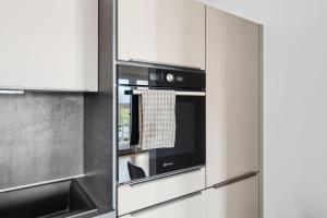 Kuchyň nebo kuchyňský kout v ubytování Charmante & Moderne Neubauwohnung mit Balkon + 7 fotografií