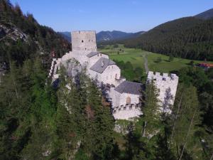 an old castle on top of a mountain at Landhaus Gschaiderhof in Puchberg am Schneeberg