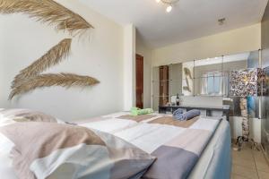 Postel nebo postele na pokoji v ubytování Penthouse con Jacuzzi