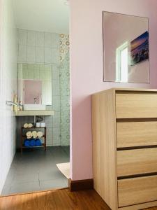 a bathroom with a sink and a mirror at Lanta sky pool villa in Ko Lanta