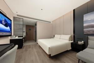 TV a/nebo společenská místnost v ubytování Atour Hotel Hohhot Stadium, Genghis Khan Avenue