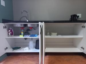 a kitchen shelf with a sink and a counter at Shaka's Rest Studio Two in Mount Moreland +12 photos
