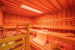 a room with four beds in a wooden cabin at Berghotel Jägerhof ****S in Isny im Allgäu +67 photos