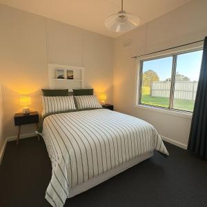 Ένα ή περισσότερα κρεβάτια σε δωμάτιο στο Longford Cottage