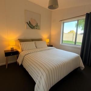 Ένα ή περισσότερα κρεβάτια σε δωμάτιο στο Longford Cottage