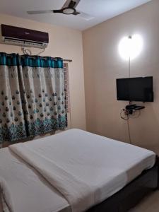 Postel nebo postele na pokoji v ubytování Symphony Suites Serviced Apartment