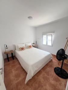 En eller flere senge i et værelse på Vivienda Vacacional Oroarse