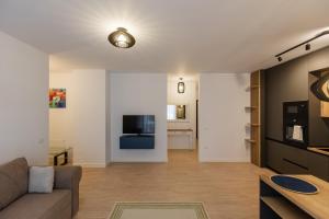 Μια τηλεόραση ή/και κέντρο ψυχαγωγίας στο Future Apartment by Residence