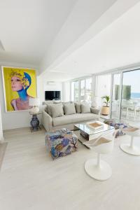 a living room with a couch and a table at MY SEA VIEW HOLIDAY APARTMENT in Maspalomas