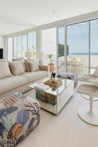 a living room with a couch and a table at MY SEA VIEW HOLIDAY APARTMENT in Maspalomas