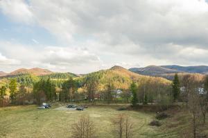 a view of a parking lot with mountains in the background at Шешори Еко in Sheshory