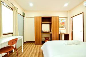 Ένα ή περισσότερα κρεβάτια σε δωμάτιο στο Thongpoon Apartment