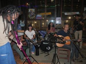 a group of people playing music in a room at Muangkham Peaceandlove Farm in Ban Doi Hang +50 photos