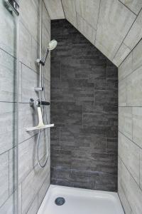 a shower with a shower head in a bathroom at Nature house in Joppe +15 photos
