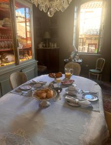 a table with a plate of food on it at manoir de Rivières in Rivières