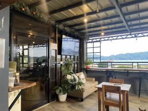 a living room with a couch and a table at Kalis Viewpoint Lodge Coron in Coron +28 photos