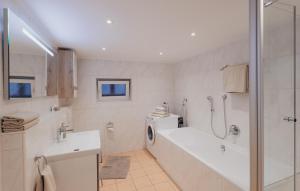 a bathroom with a tub and a sink and a shower at Bürgstadt, Am Bischof mit Sonnenterrasse, 1 bis 4 Betten in Buergstadt +67 photos