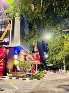 a city street with a building and a street light at Scarletz klcc by R&R in Kuala Lumpur