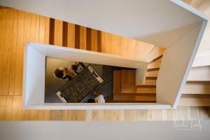 two people are on a staircase in a building at Maison de Lacam in Castanet