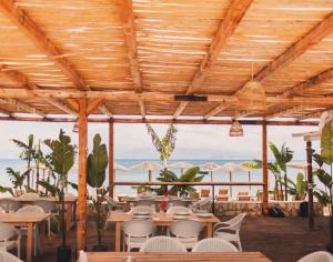 a restaurant with a view of the ocean at Erosea Beach Resort in Kavos