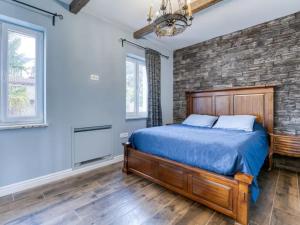 a bedroom with a bed and a brick wall at Luxury Home Villa Pallazzo in Lovran +22 photos