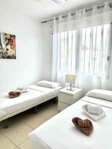 Ένα ή περισσότερα κρεβάτια σε δωμάτιο στο DUPLEX C6 con PISCINA PRIVADA