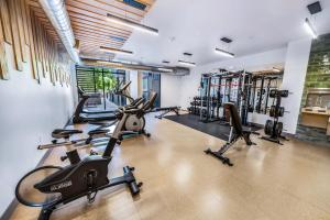 a gym with several treadmills and exercise bikes at Sugarhouse! Mountain View 3BR, 2BA Gym, Parking in Salt Lake City