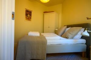 En eller flere senge i et værelse på Best Stay Copenhagen Apartment 1506