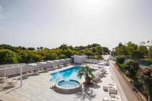 an aerial view of a resort pool with lounge chairs at Garden Hotel Ripa in Vieste