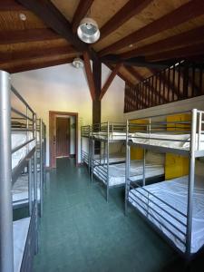 a room with several bunk beds in it at ALBERGUE DE LASTUR in Deba