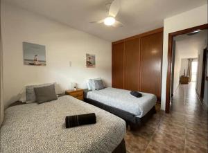 Ένα ή περισσότερα κρεβάτια σε δωμάτιο στο Apartment in Arona, Guaza