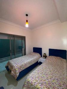 En eller flere senge i et værelse på Blanca beach