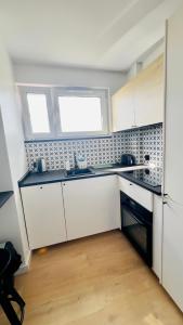 Kuchyň nebo kuchyňský kout v ubytování Przyjazny Kąt