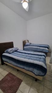 Postel nebo postele na pokoji v ubytování Apartamento confortável a 5min da Basílica