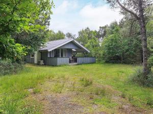 a small house in the middle of a field at 5 person holiday home in Ålbæk-By Traum in Ålbæk