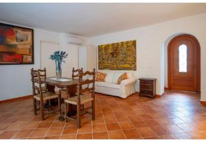 a living room with a table and a couch at Villa Talia Sweet Rooms B&B in Ischia