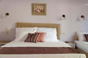 Postel nebo postele na pokoji v ubytování Alexandra Hotel