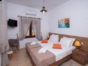 Katil atau katil-katil dalam bilik di Atalanti Seaside Junior Suites, Beachfront