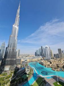 a view of a city with a tall building at Burj Khalifa View Apartment in Dubai