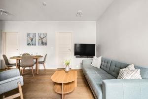 Et tv og/eller underholdning på Light & Modern, City Apartment