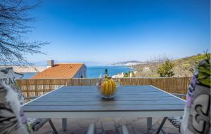 a table with a bunch of bananas on top of it at Amazing Apartment In Kraljevica With Wifi in Kraljevica +14 photos