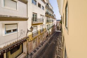 an alley way between buildings in a city at Private Pool Chiado Gem, Patio Retreat wAC in Lisbon