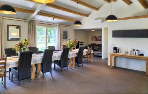 a large dining room with a long table and chairs at 3 Bedroom Lovely Home In Beesel in Beesel