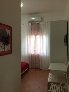 Cama ou camas em um quarto em Villa Cenzina