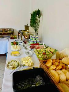 a table with many different foods on it at Przystań Ostróda - pokoje i apartamenty in Ostróda +114 photos