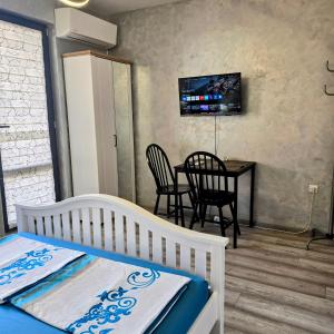 TV a/nebo společenská místnost v ubytování Aпартамент 5