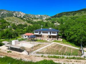 an aerial view of a house in the mountains at Vila Dr Bizhga Agroturizem 